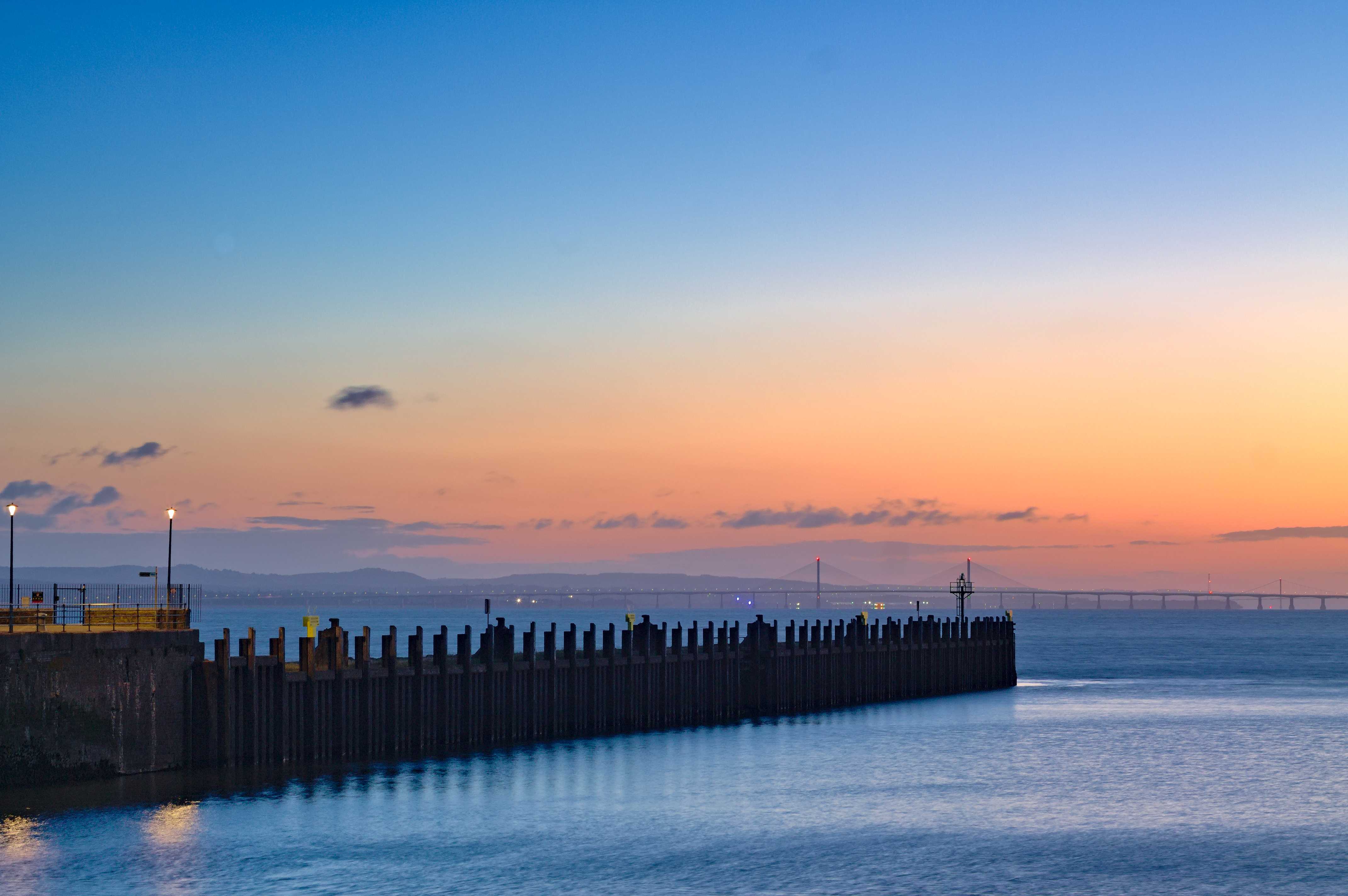Portishead pier at night with vibrant clouds